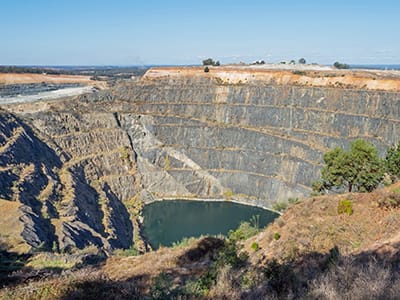 The Greenbushes lithium mine is an open-pit mining operation in Western Australia and is the world's largest hard-rock lithium mine. It is located to the south of the town of Greenbushes, Western Australia.